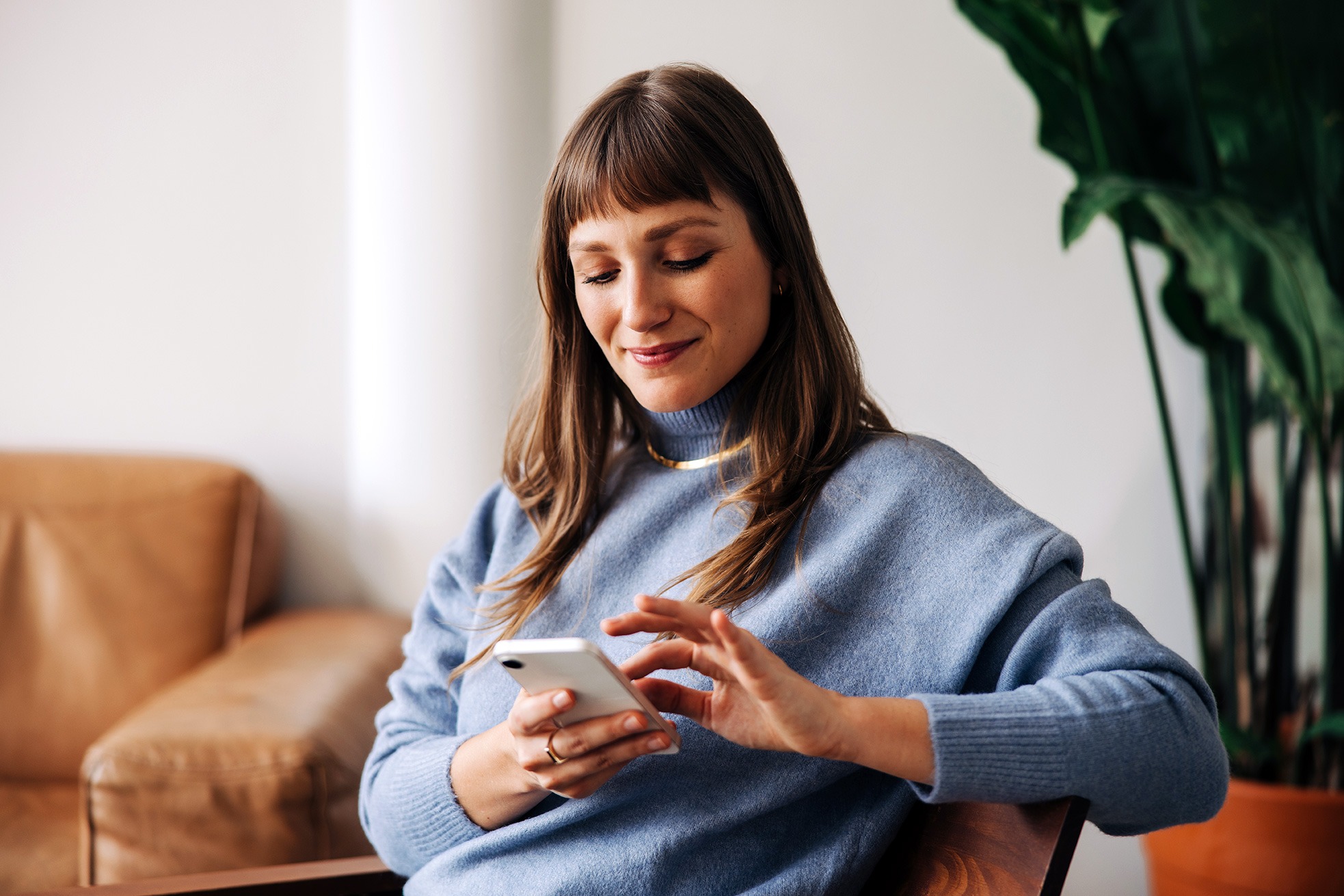 A woman holding her phone.