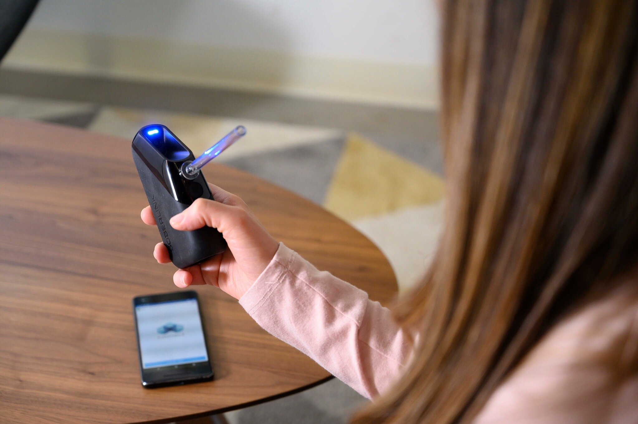 A woman submitting Soberlink test