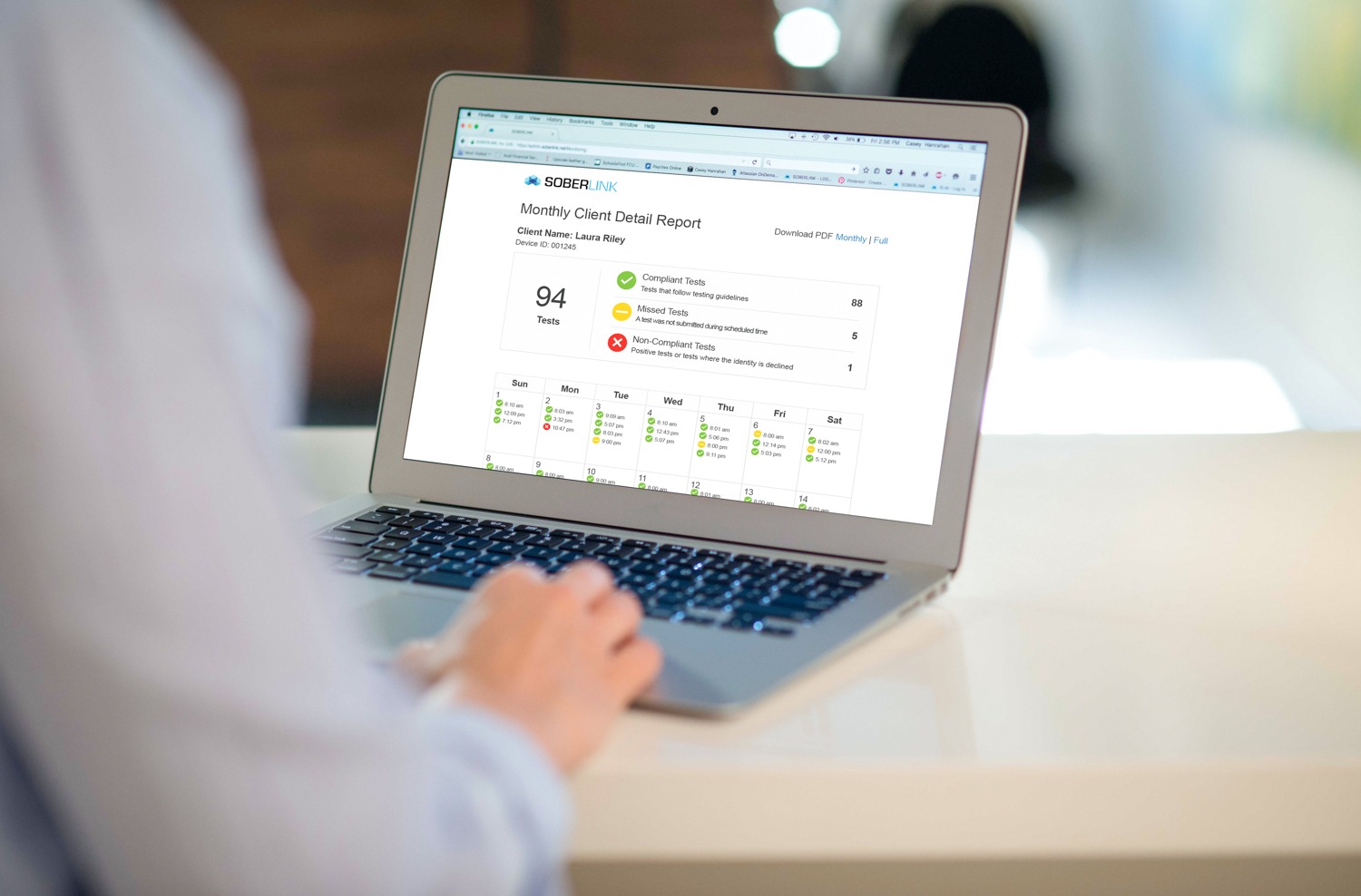 A laptop screen displaying Soberlink's advanced reporting.