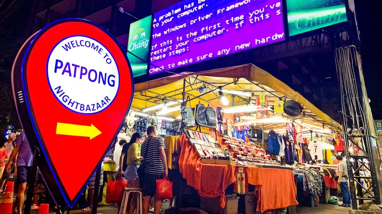 welcome to Patpong sign with the night market stalls in Bangkok