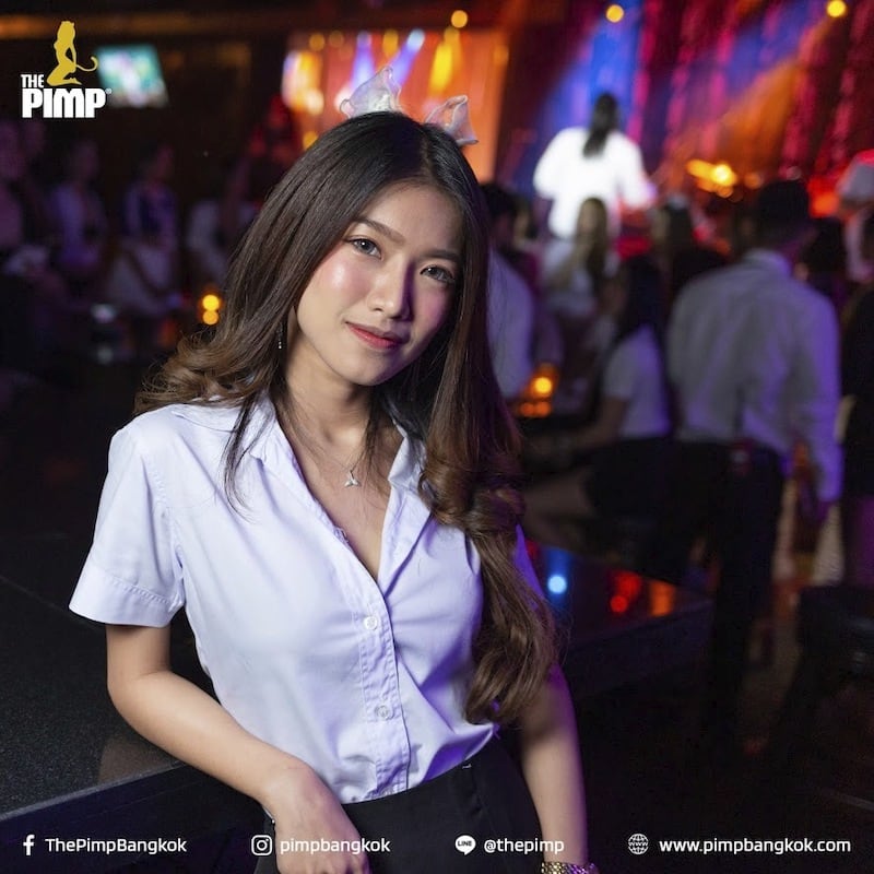 cute Thai girl with student clothes at The PIMP gentlemen club in Bangkok