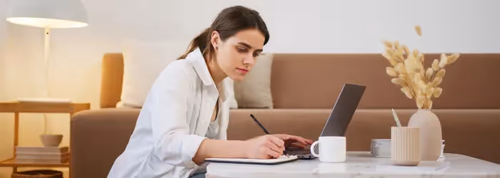 A woman writing a personal message for her colleague