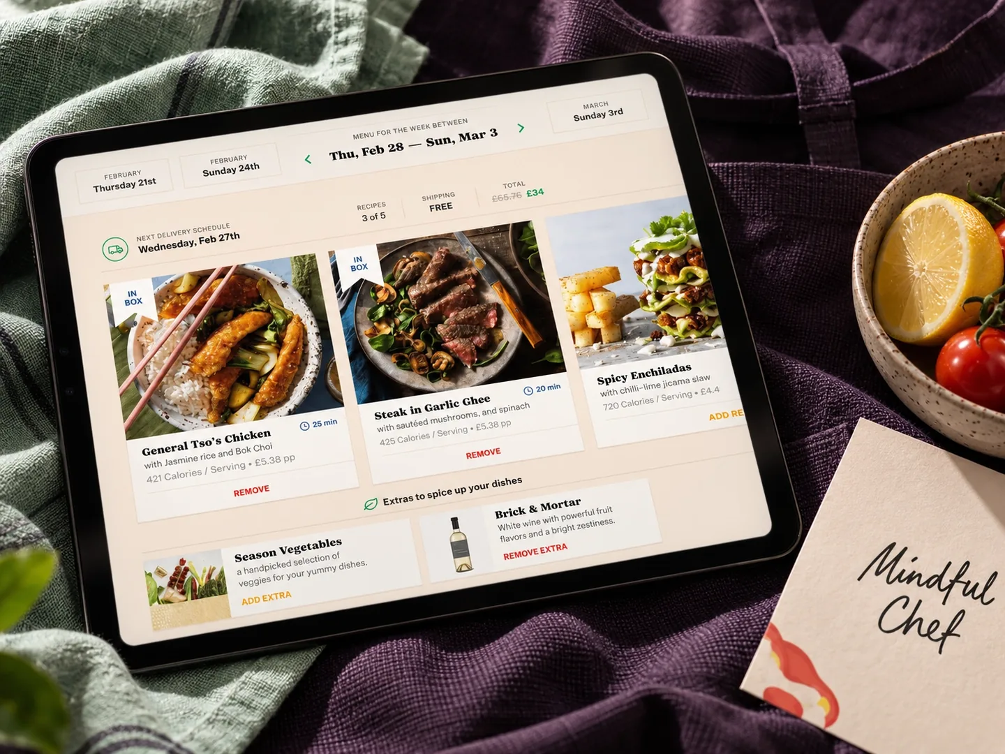Mindful Chef recipe website displayed on a tablet beside vegetables and a branded card