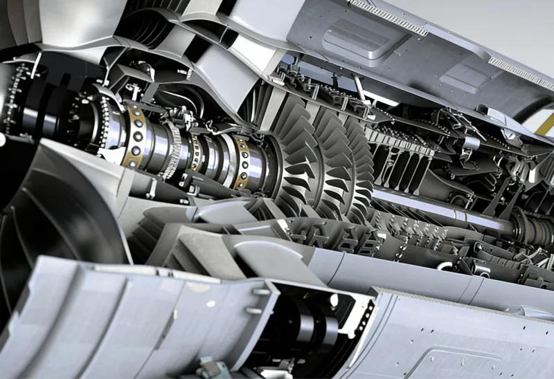 Close-up view of a detailed aircraft jet engine cutaway showing turbine blades and internal components.