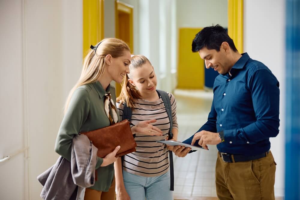principal talks to learner and parent about online class schedule