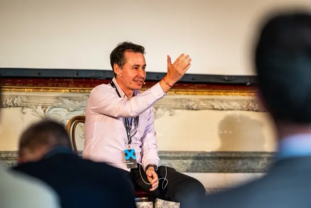 Tarik Benabdallah, discussing agentic AI from the stage