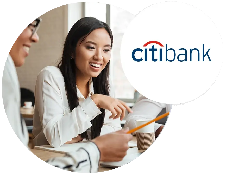 A woman at her laptop next to Citibank logo