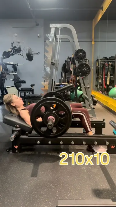 Client performing a barbell hip thrust at UTG Personal Training in Bergen County NJ