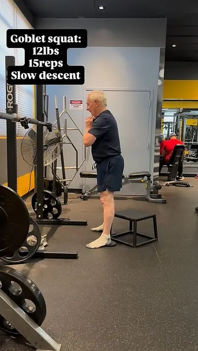 Senior personal training client performing a goblet squat at UTG in Westwood NJ