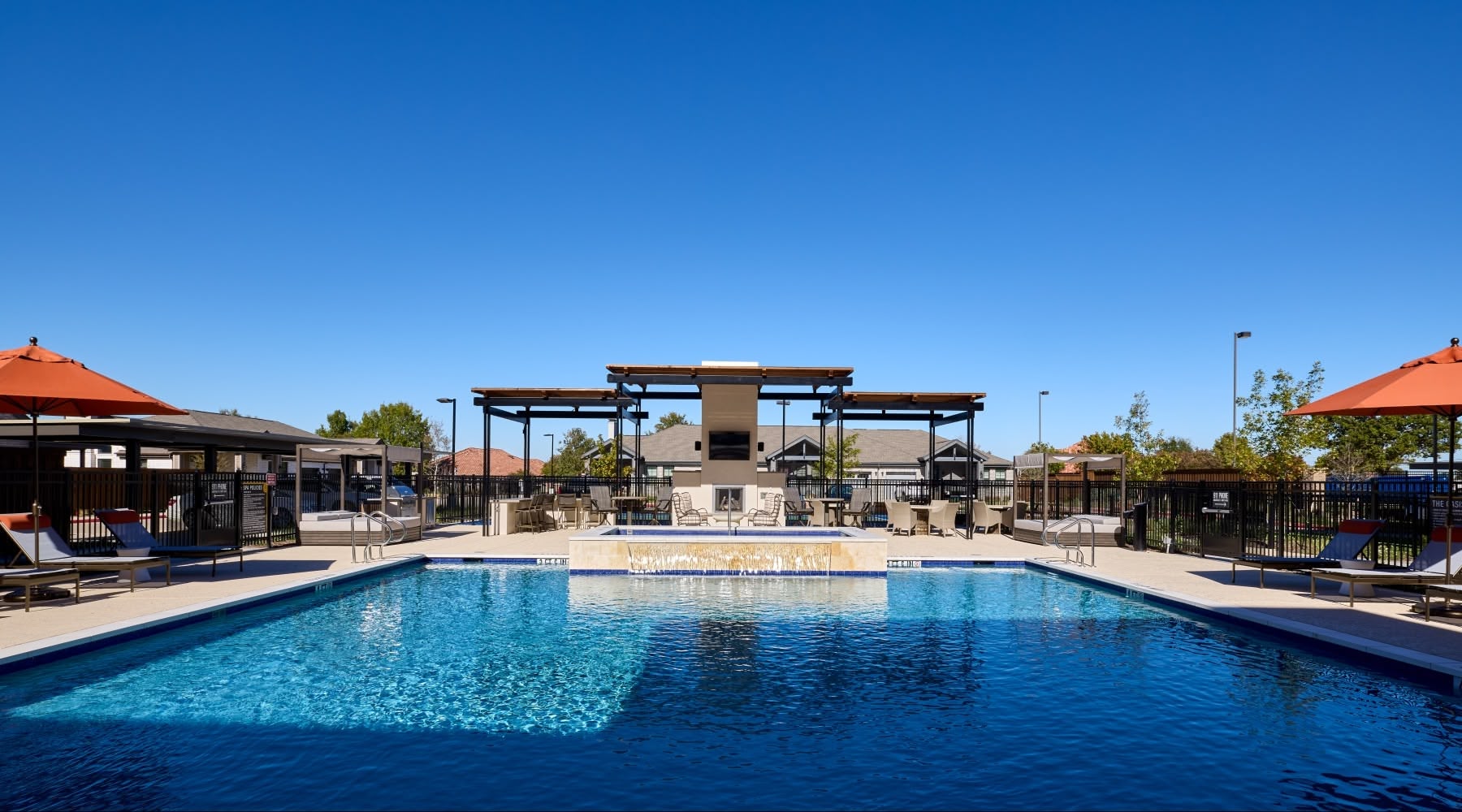 outdoor apartment pool under blue sky