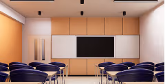 Empty classroom with rows of desks and chairs facing a blackboard and whiteboard on a wooden wall.