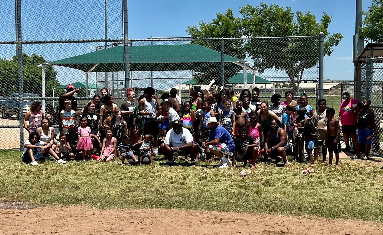 A B U group pic at community volleyball game