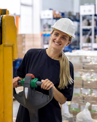 Woman driving pallets distribution