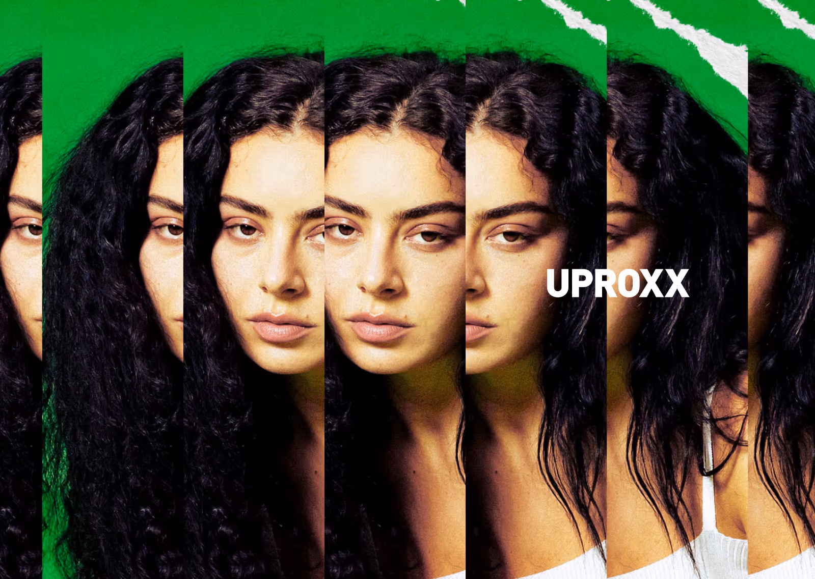 Portrait of a woman with curly dark hair in front of a green background with a repeated overlapping effect and the word UPROXX.