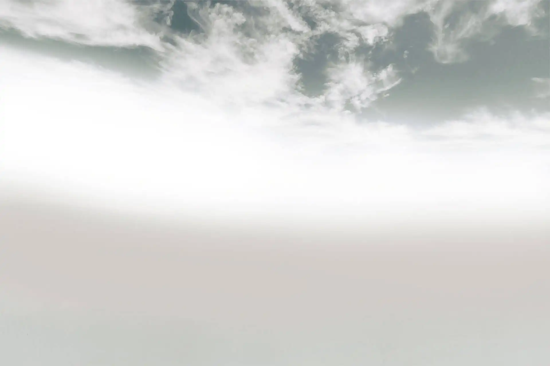 Pale clouds with a blue sky.