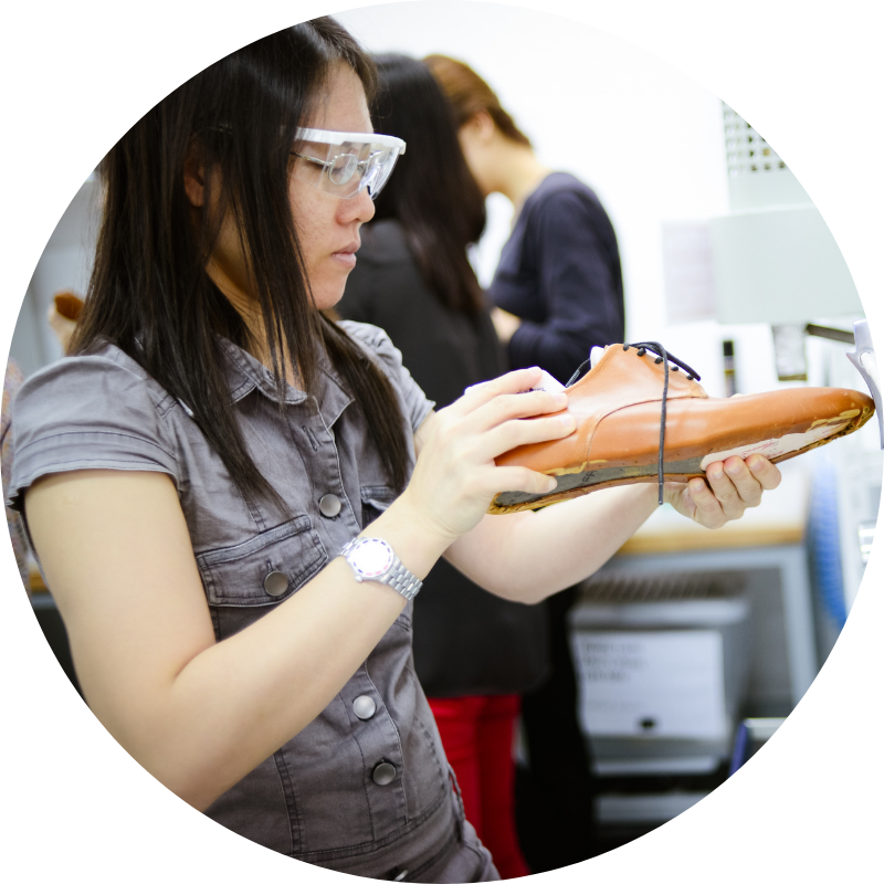 woman refine's a men's shoe