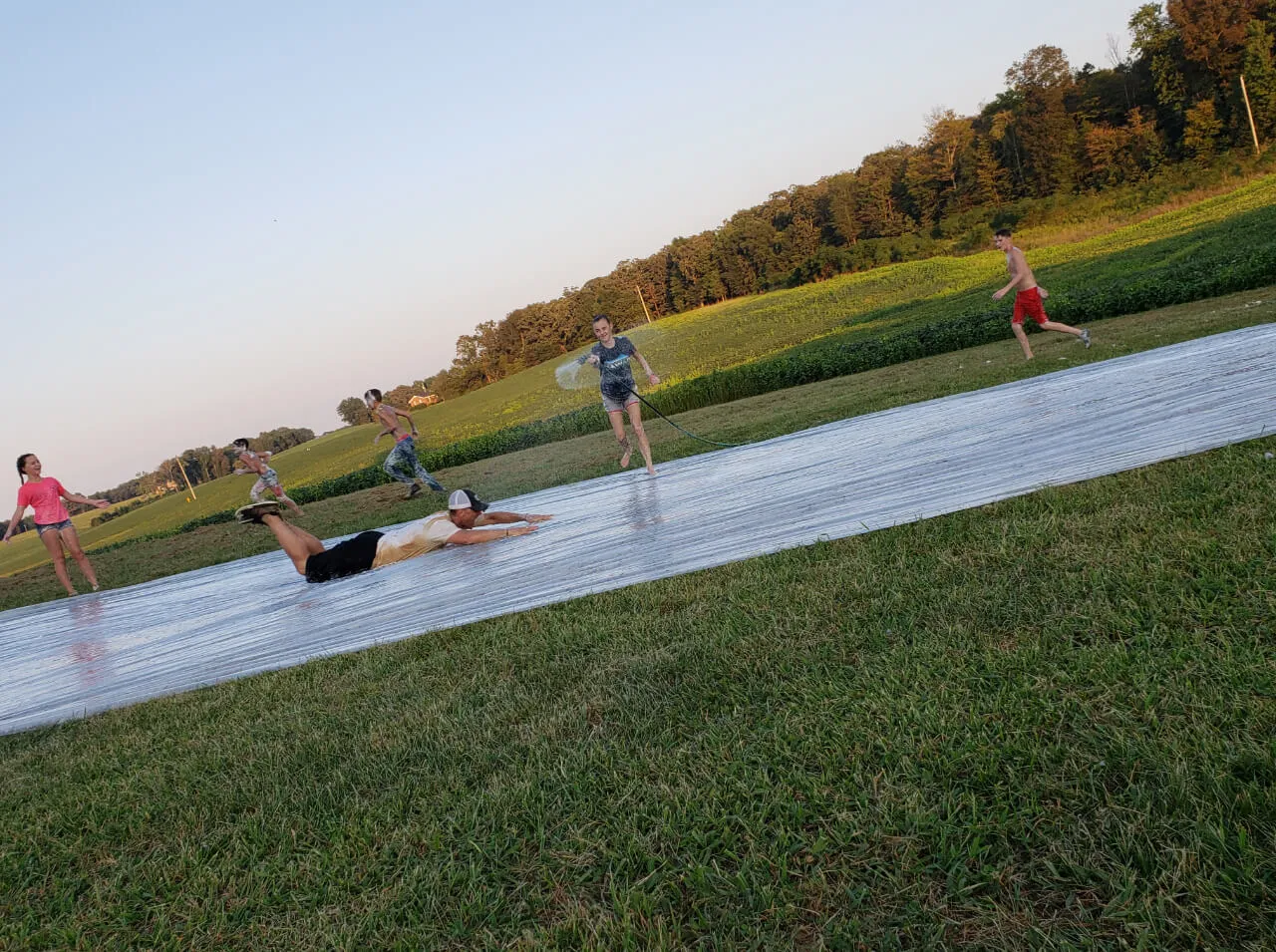 man slipping in a plastic splashed with water at First Baptist Church- Indian Trail