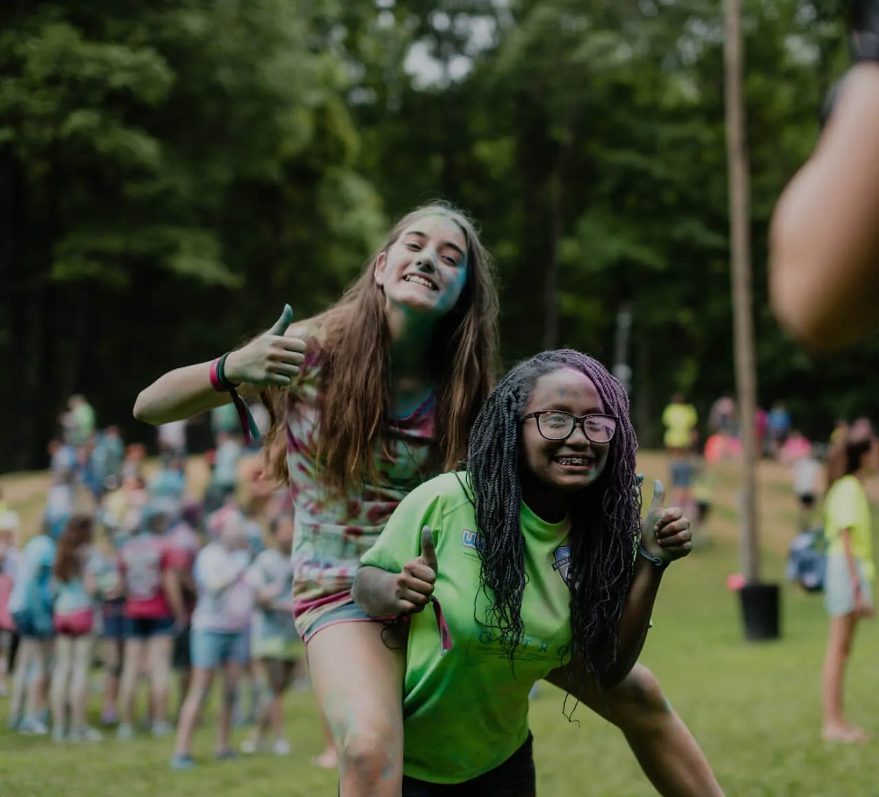girl with green shirt piggy back the girl with tie dye shirt at First Baptist Church- Indian Trail