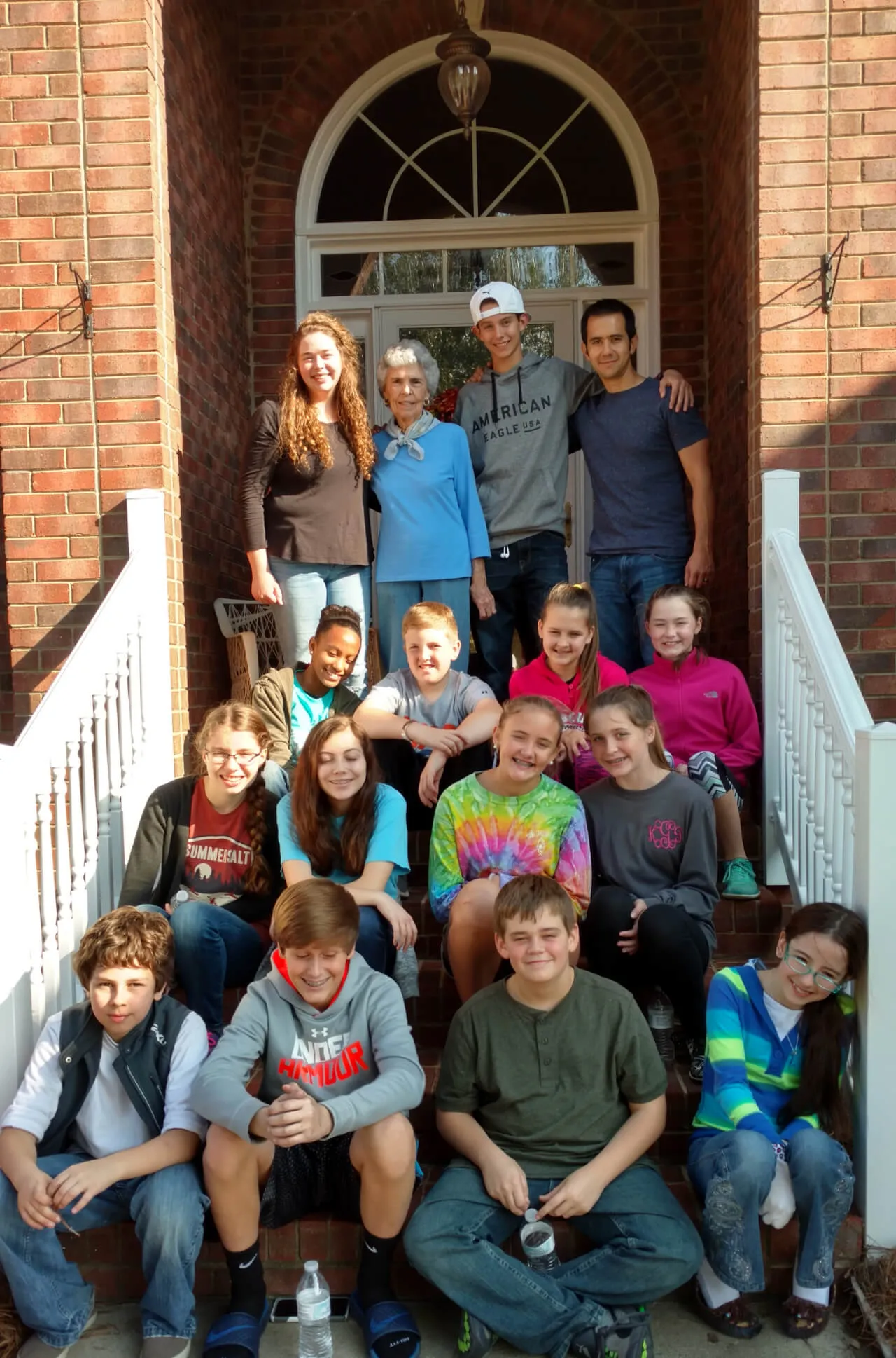 people sitting on the stairs outside at First Baptist Church- Indian Trail