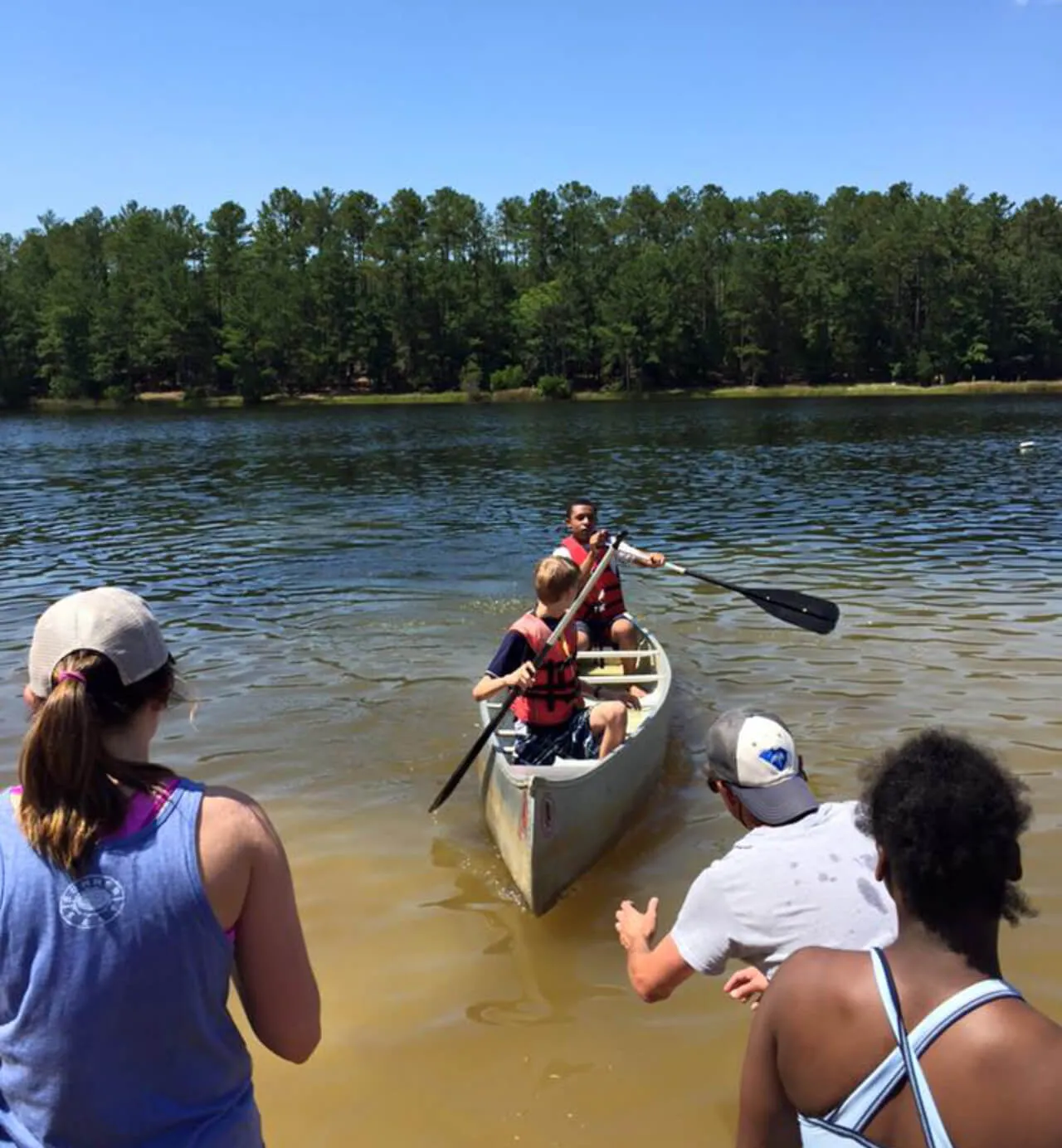 two little boys in the boat with life jackets at First Baptist Church- Indian Trail
