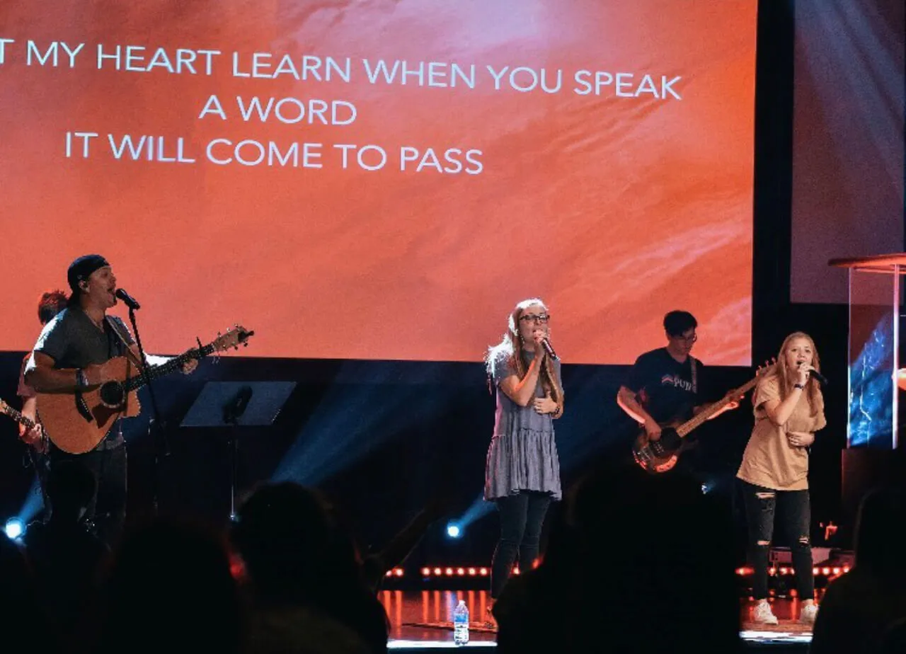 group singing at the stage at First Baptist Church- Indian Trail
