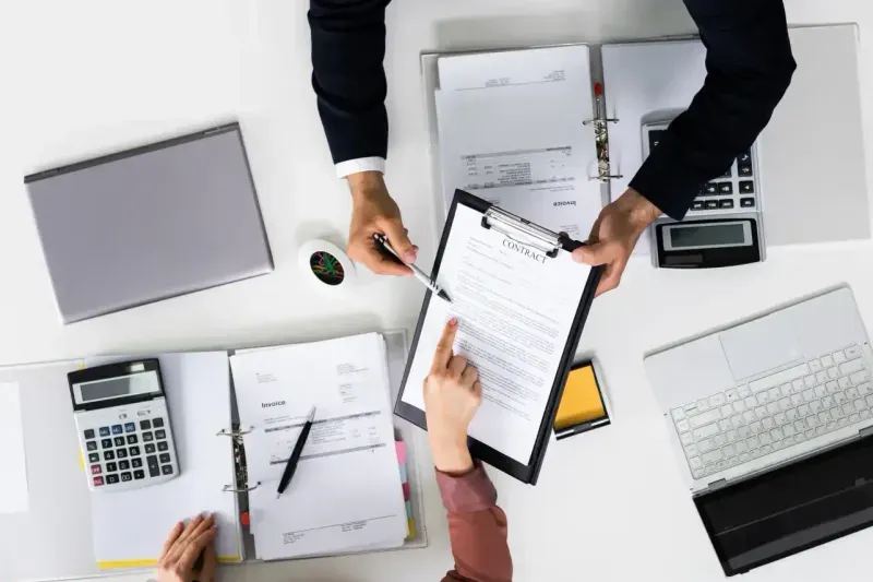 Supplier reviewing the clauses in a contract of services