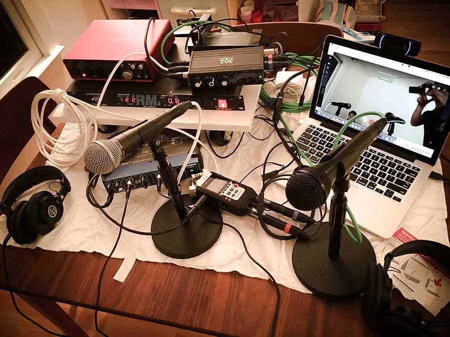 Double ender hardware including a laptop, podcast webcam, microphones and audio mixer.