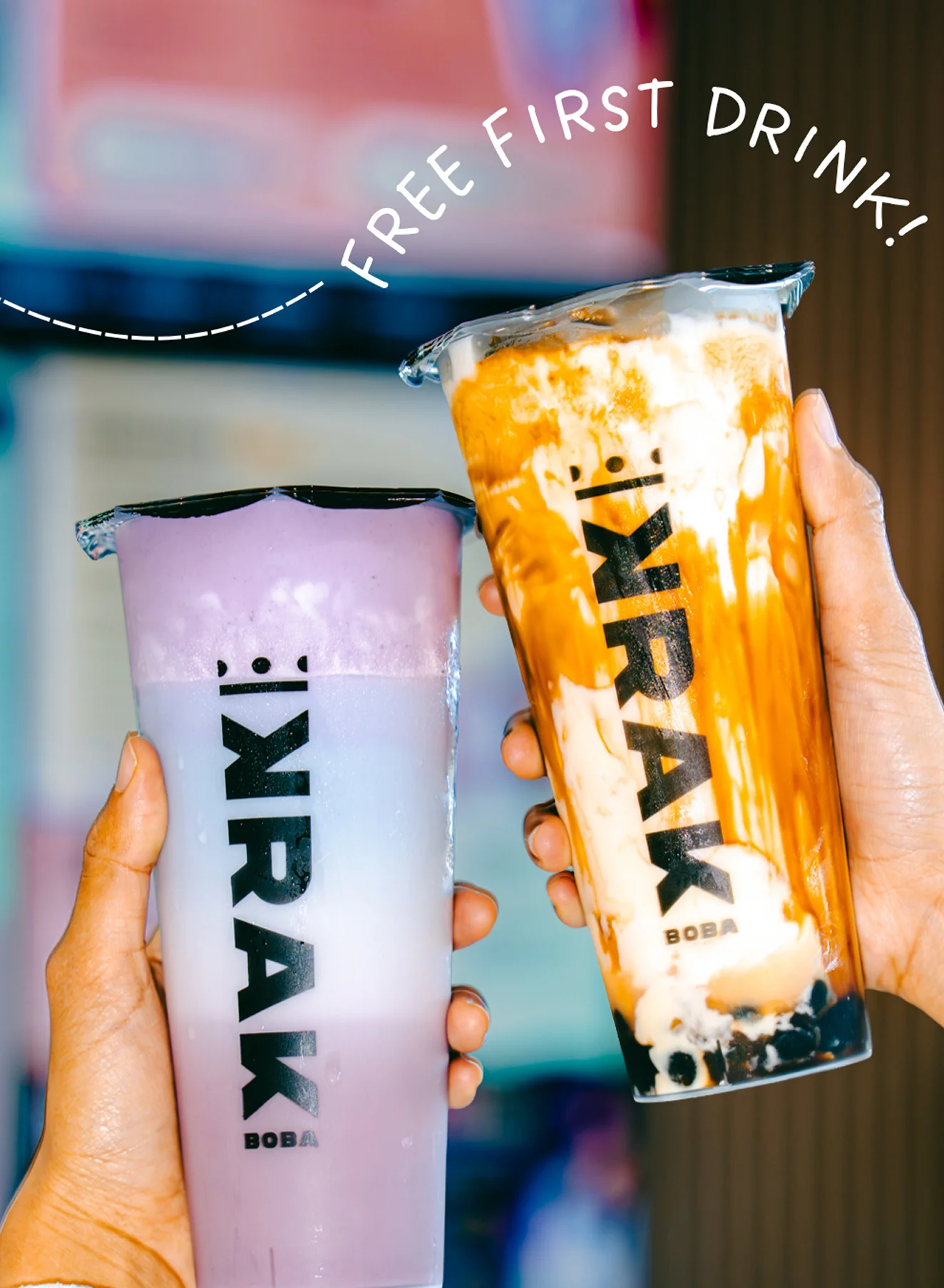 Two Krak Boba drinks, including a purple milk tea and a brown sugar boba with tapioca pearls, promoting the free first drink offer.