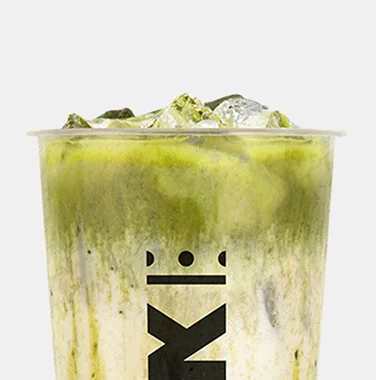 Krak Boba iced matcha milk tea with creamy swirls served in a branded cup.