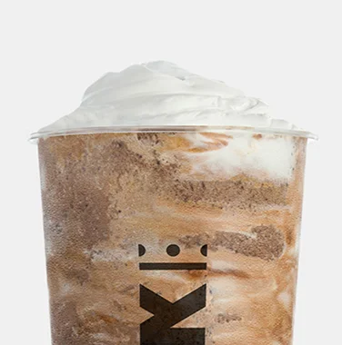 Krak Boba chocolate smoothie topped with whipped cream in a branded cup.