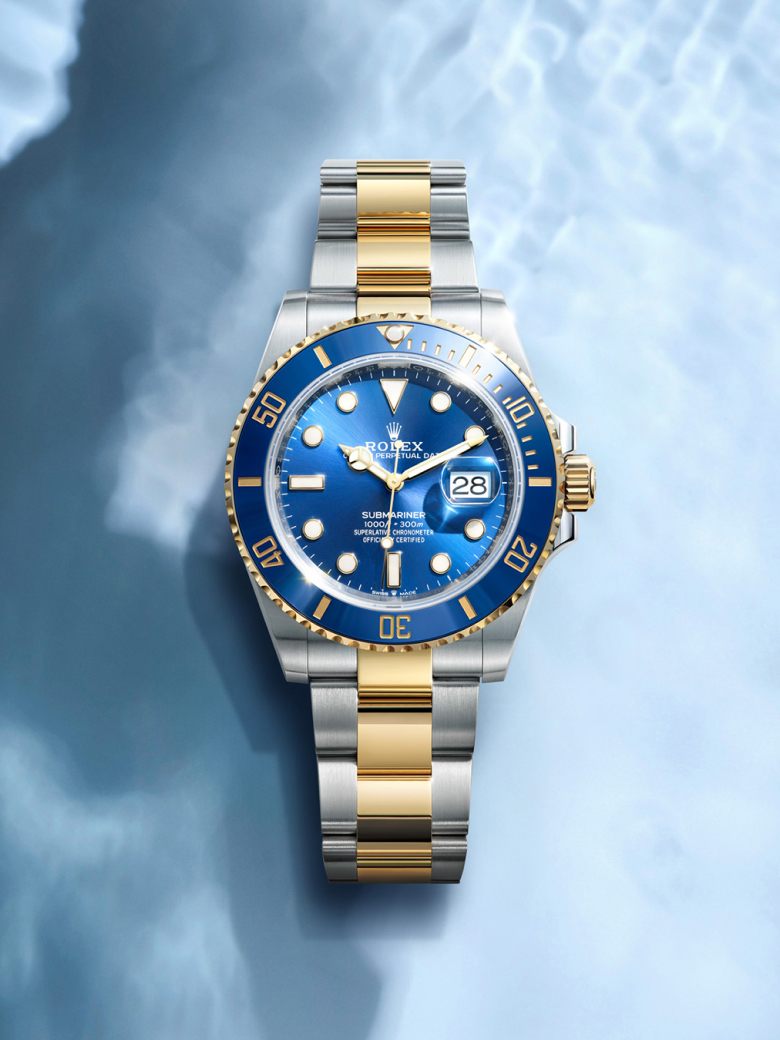 Rolex Submariner i Oystersteel med svart urskive, dreibar én vei bezel og Oyster lenke.
