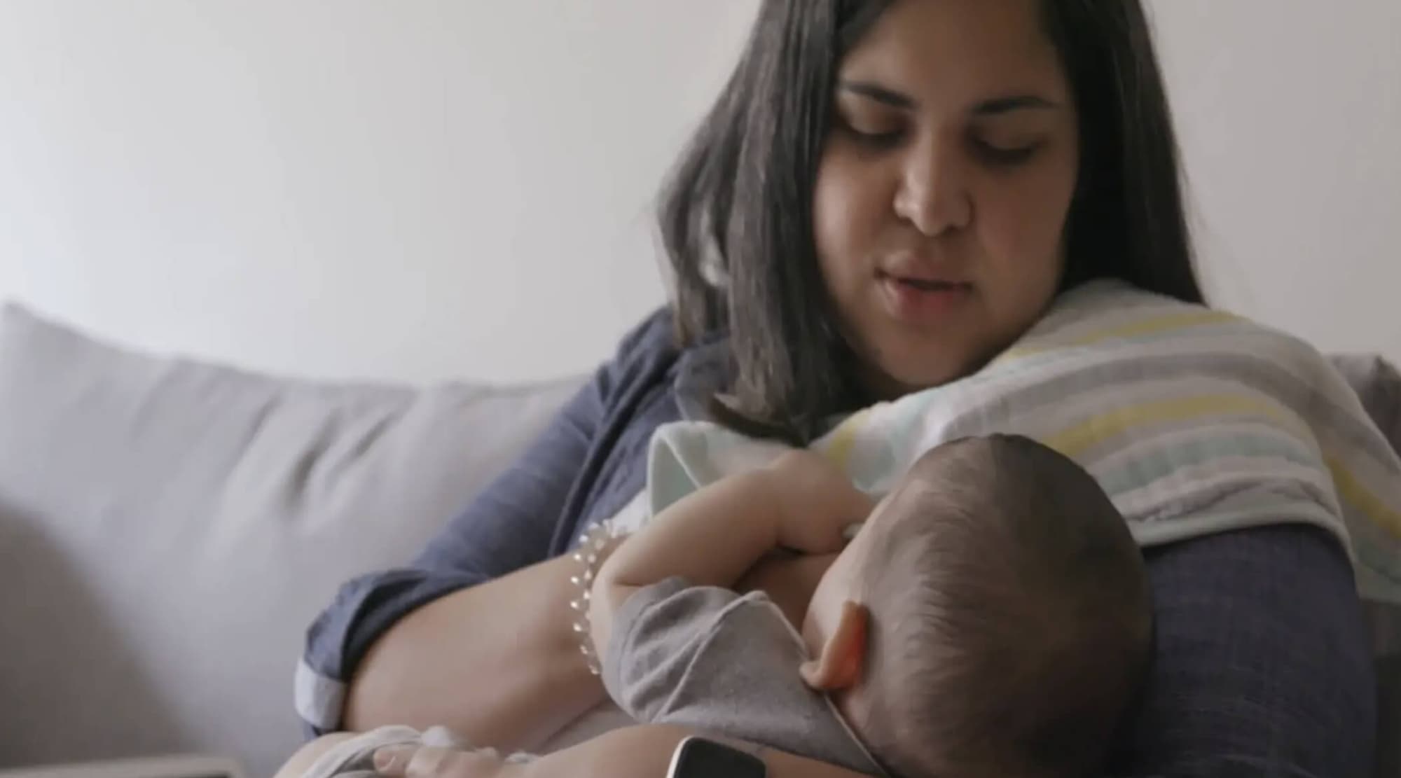 Women breastfeeding child