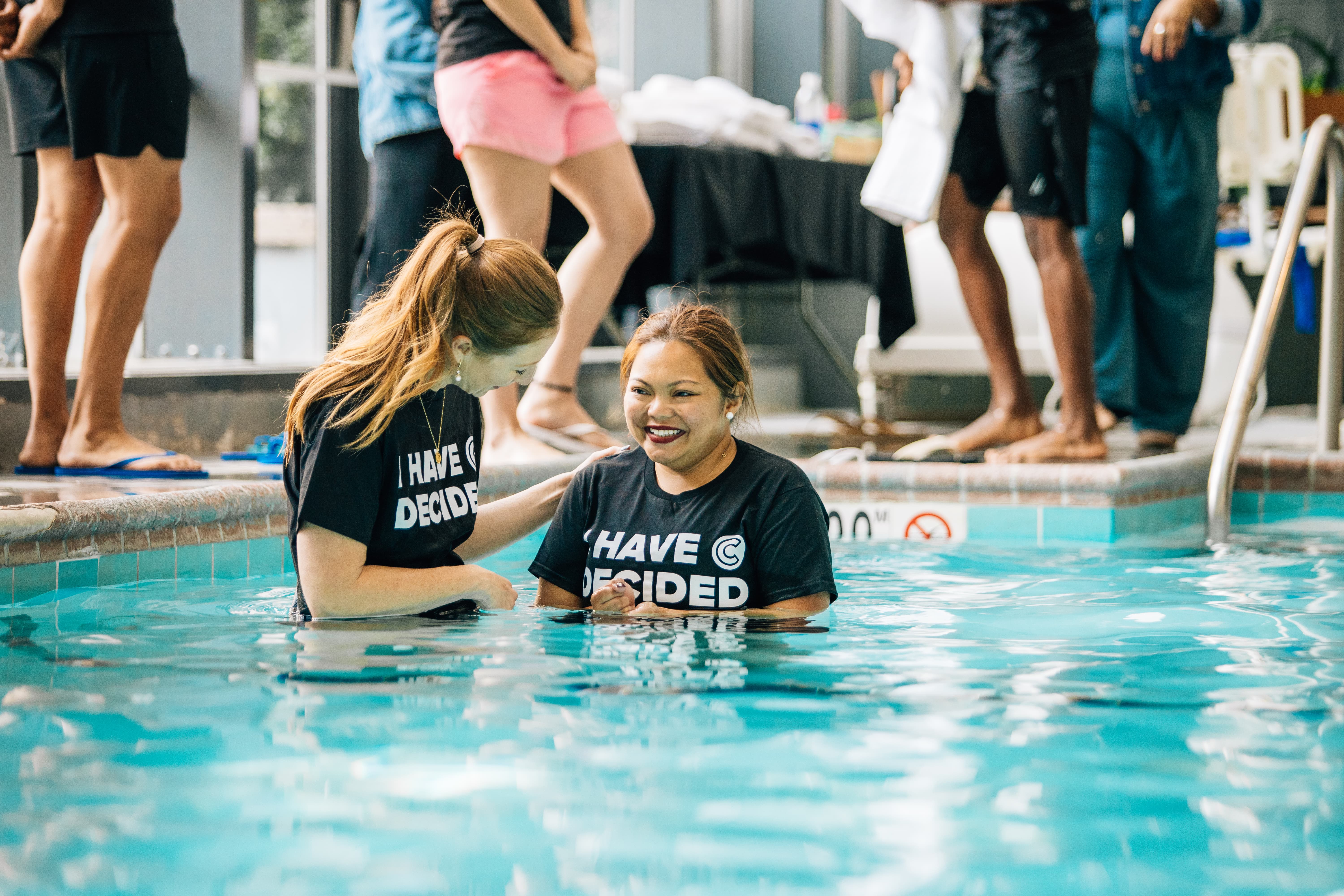 Two women Holding Sign Of Community Group