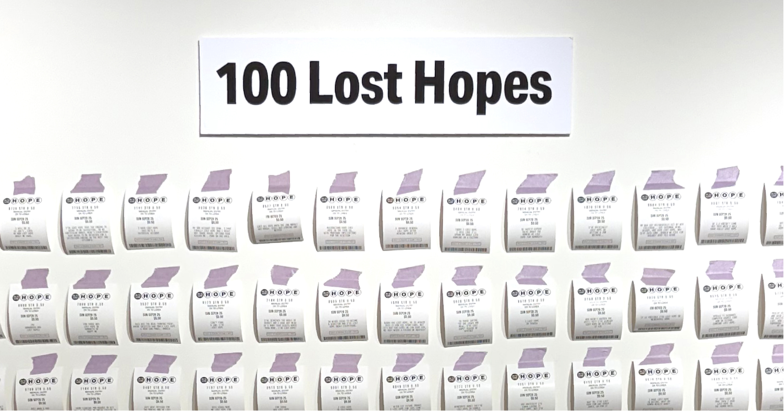 Black text on a white wall reads "100 Lost Hopes." Underneath it are rows of custom-printed lottery tickets, attached to the wall with light purple tape. 