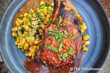 Double bone in pork chop - Black bean Achiote purée - Esquites - Sauce made with red wine, lime juice, beef stock, achiote, brown sugar, and Maui Wowee from the spiceology fam.