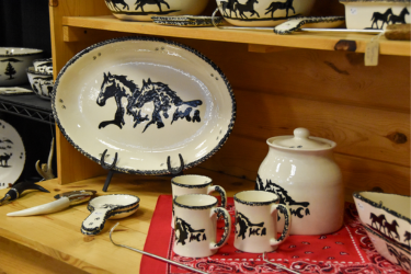 Silverware with images of horses being sold