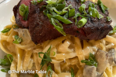 Whiskey Dijon Cream sauce with fettuccini, sautéed mushrooms and shallots topped with grilled flat iron