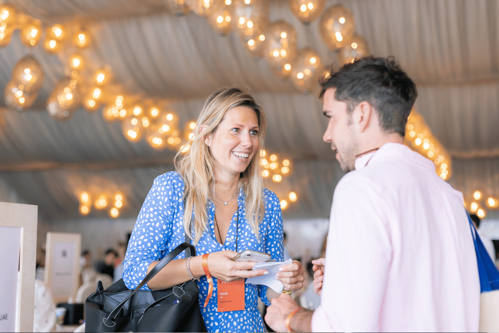 two people networking at a conference