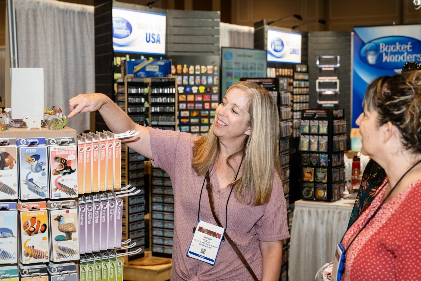 Exhibitor showing products to a buyer at The Gathering