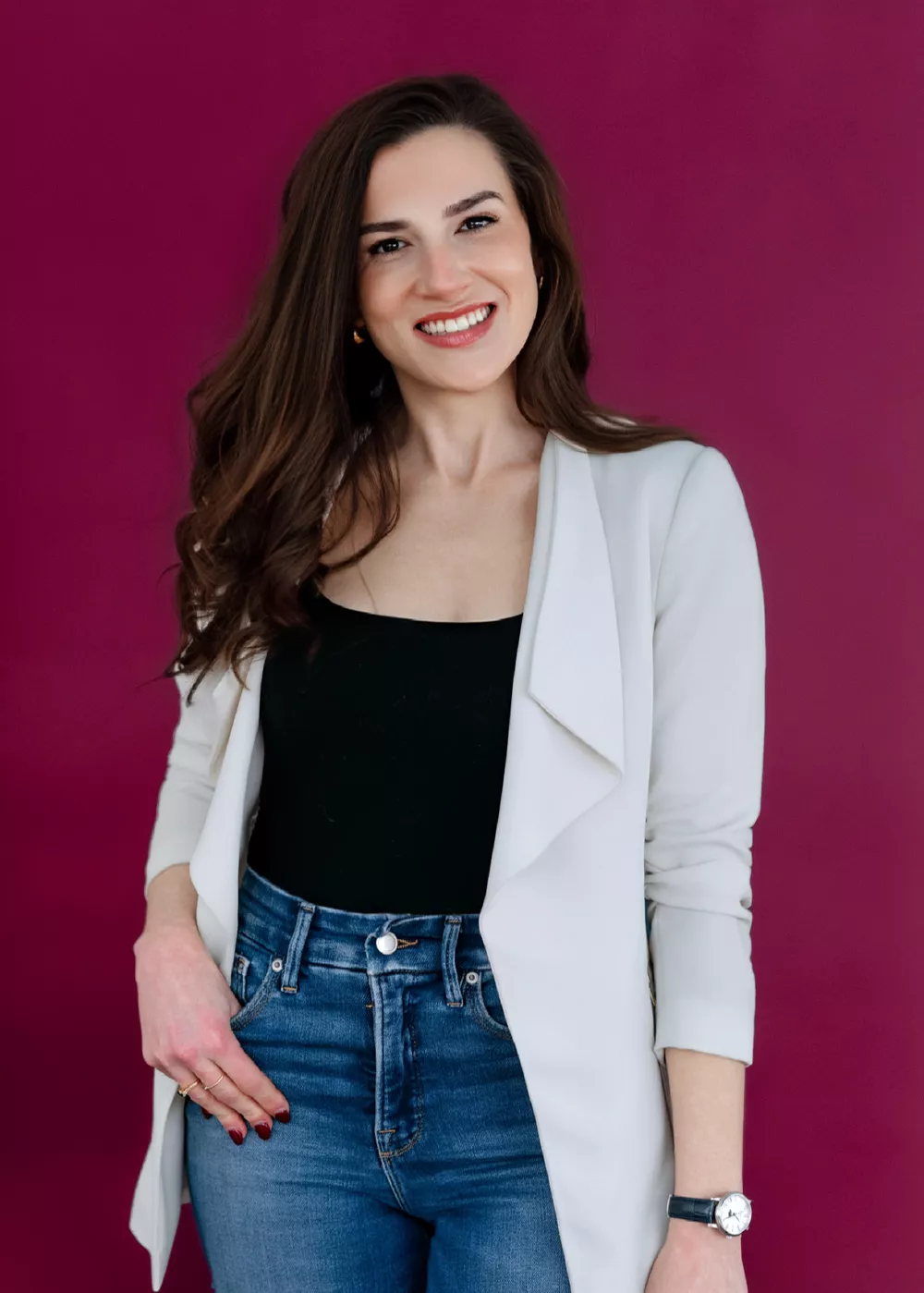 Headshot of Meaghan Sandtorv against a dark red background