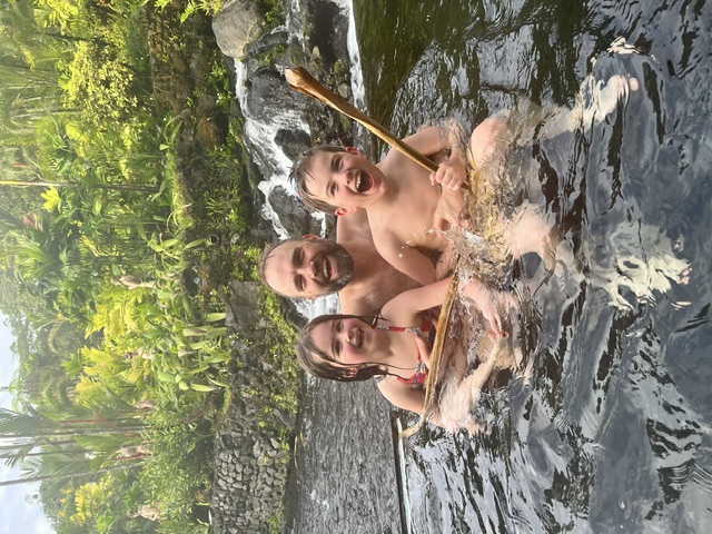 Playing with bamboo poles in the hot springs waterfall