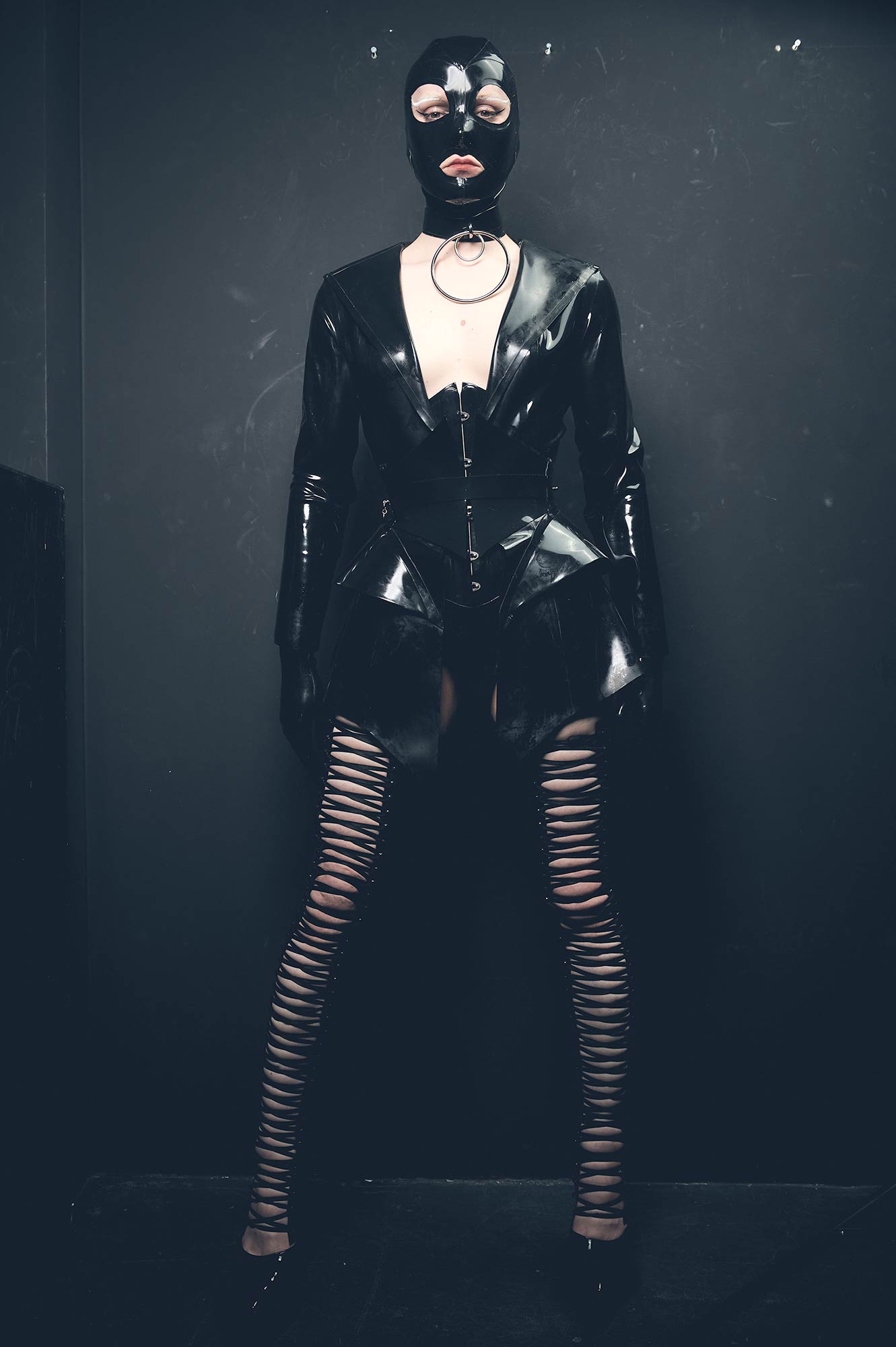 Black thigh-high laced latex spats, that can fit over any heeled shoe