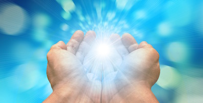 hands holding white and blue light with rays of light spreading out
