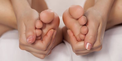 acupressure applied to hand and feet