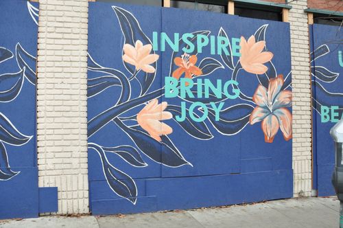 Racial justice street art on side of boarded up building