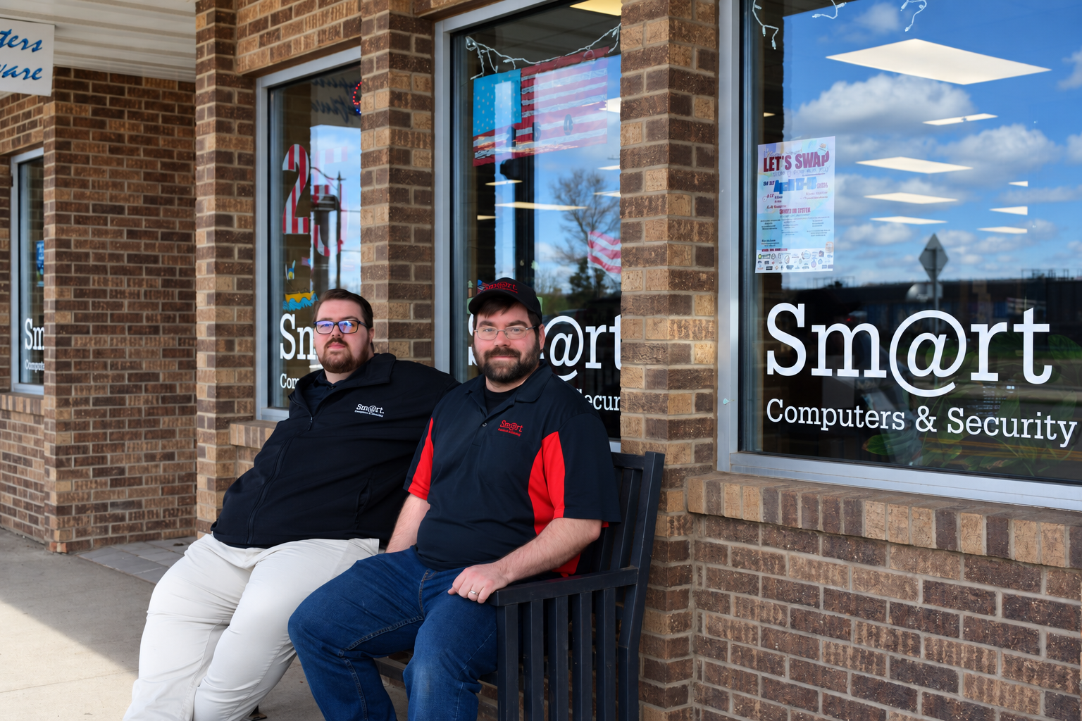 Two Smart Computers technicians outside the Smart Computers & Security storefront in Dickinson, North Dakota