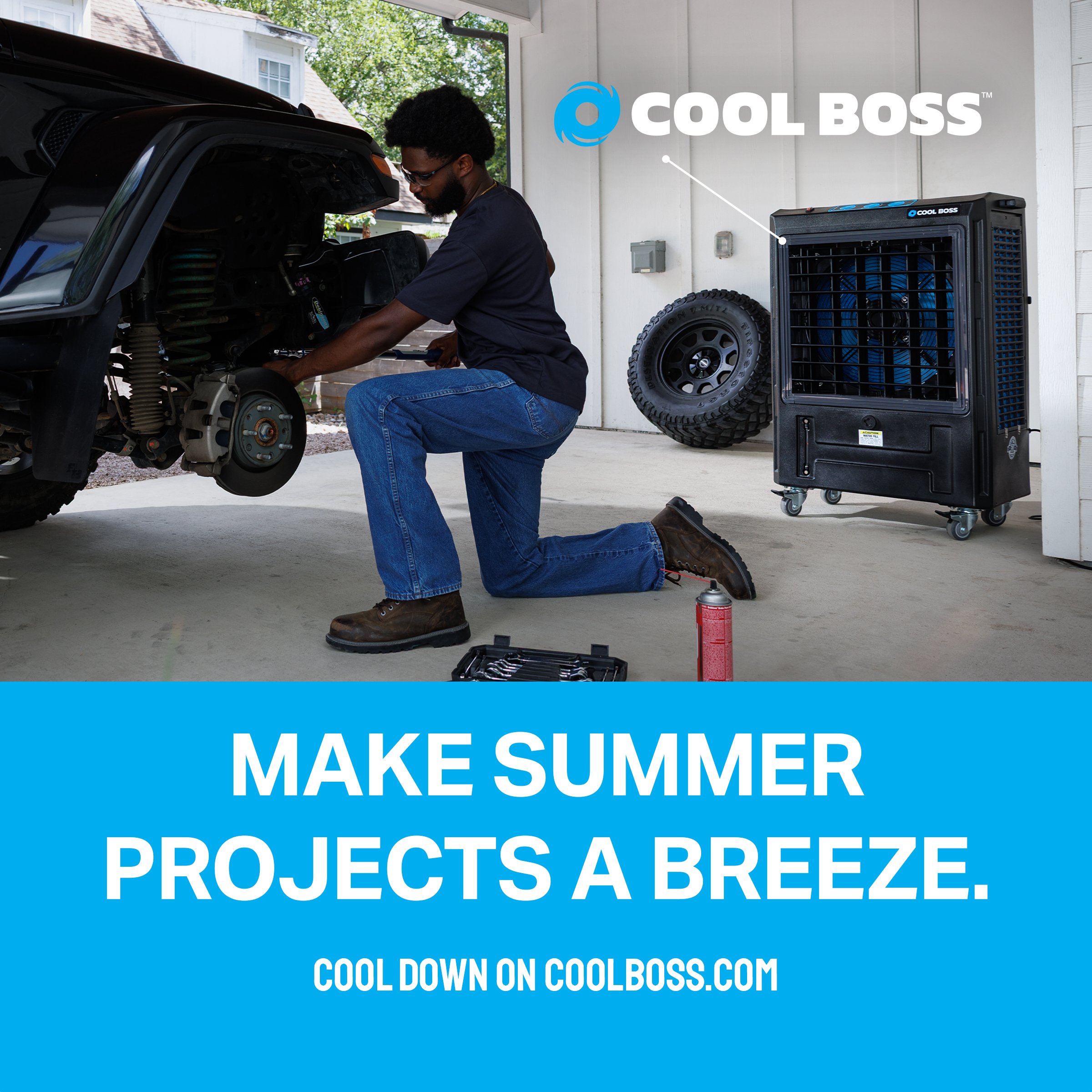Mechanic working on a truck beside a Cool Boss cooler – "Make summer projects a breeze" ad