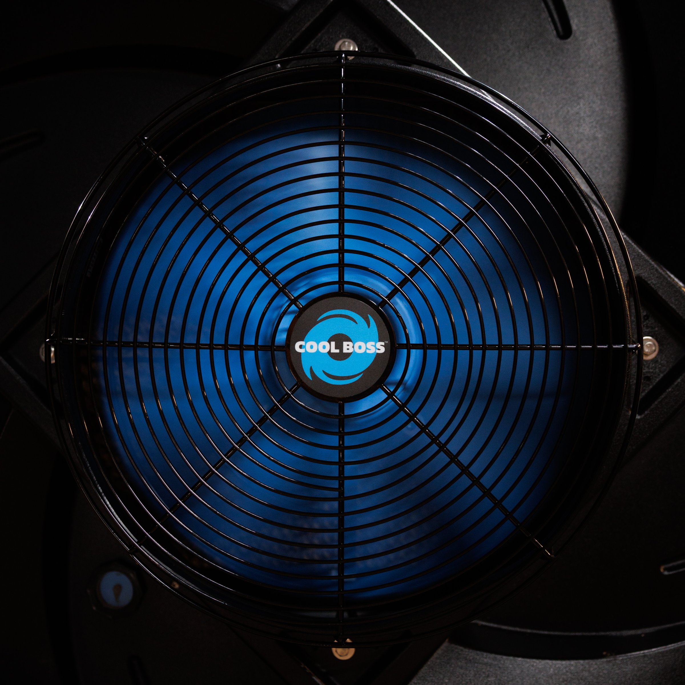 Close-up of a Cool Boss fan with blue blades and logo