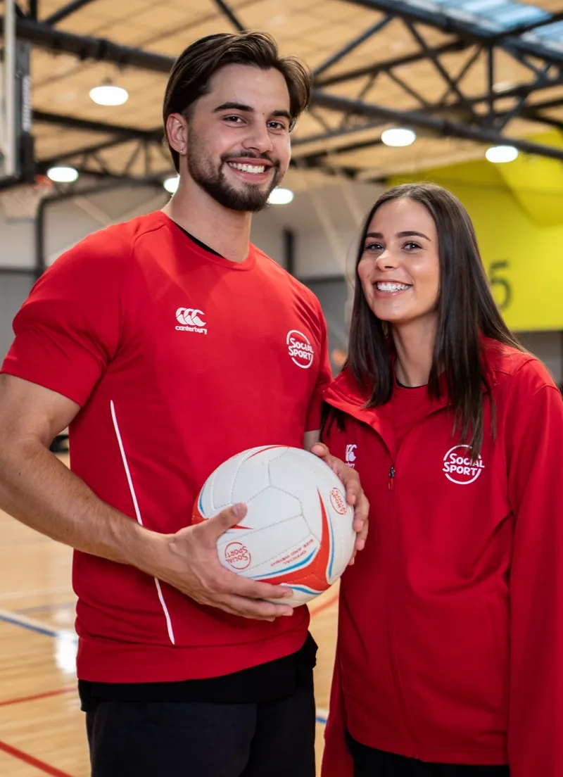 A male and female netball player