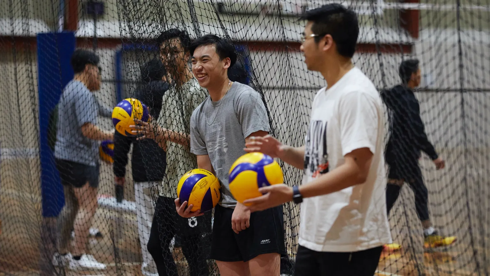 Two male Volleyball players about to start playing